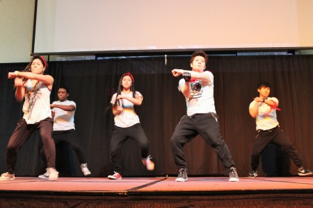 Members of the Hallyu Academy break-dance on stage.