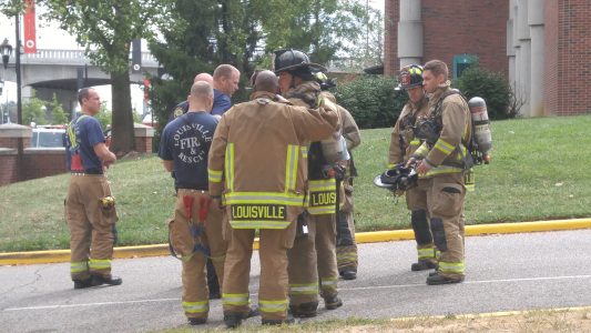 Firefighers near chemical building