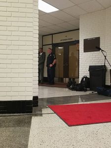 An officer was stationed outside Postel's Oct. 2 meeting