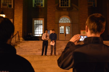 Two members of the Triangle fraternity speak thank students for coming out on Thursday night. 