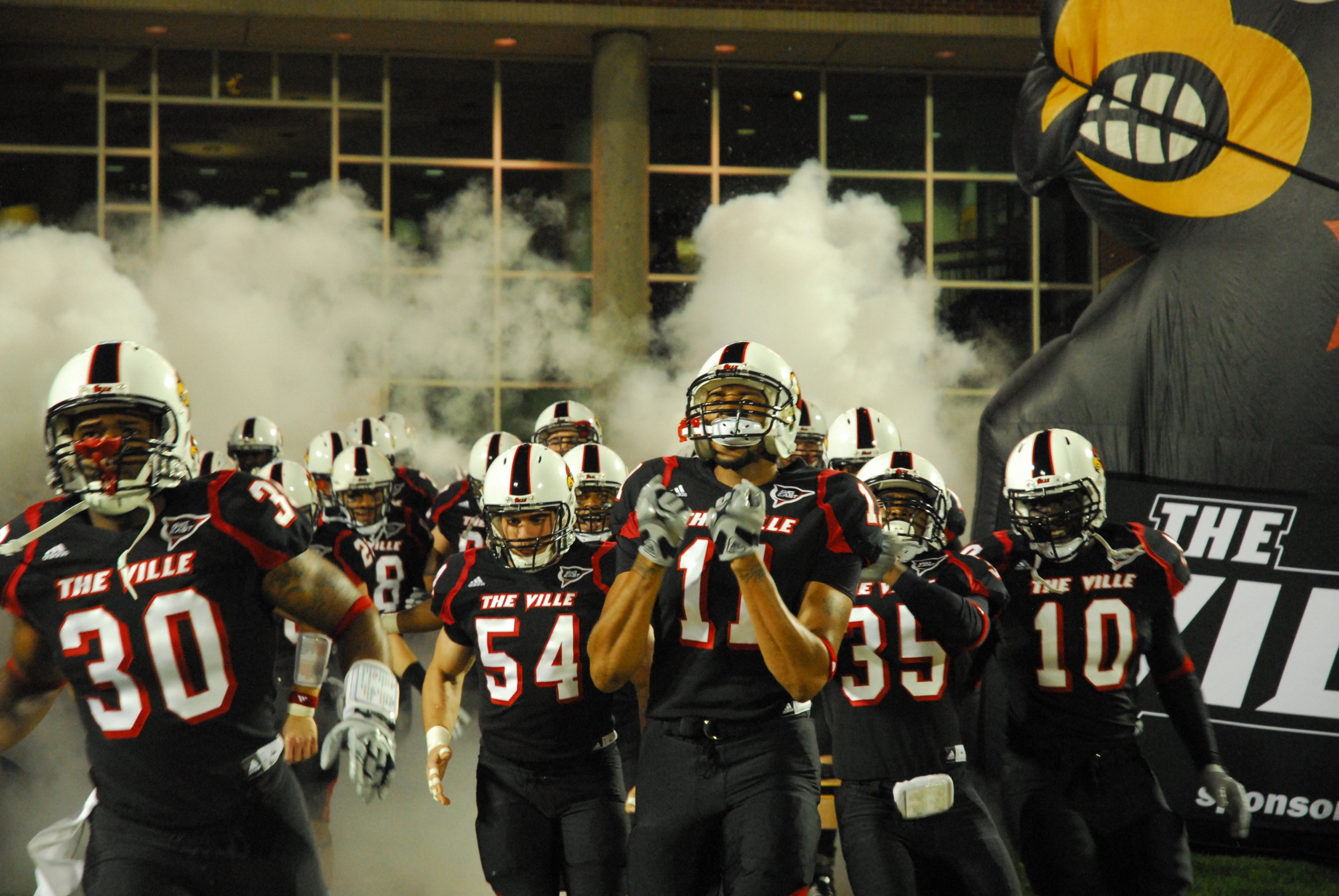Louisville's homecoming game served as the black out game for the year. In accordance the team emerged on the field dressed in all black.